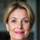 Headshot of Emily R., a determined and confident woman in her early 50s, exuding resilience.