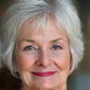 Headshot of Jessica W., a warm and content woman in her late 60s, looking relaxed and satisfied.